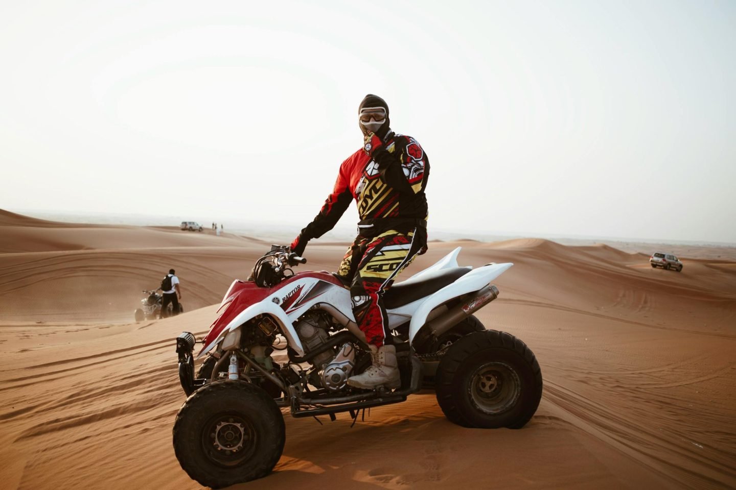 Man on bike in the middle of dessert track racing