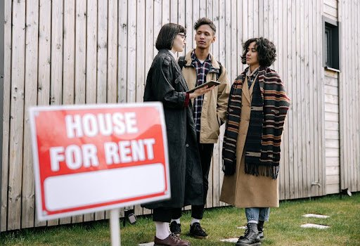 Interracial Couple Talking to a Property Manager
